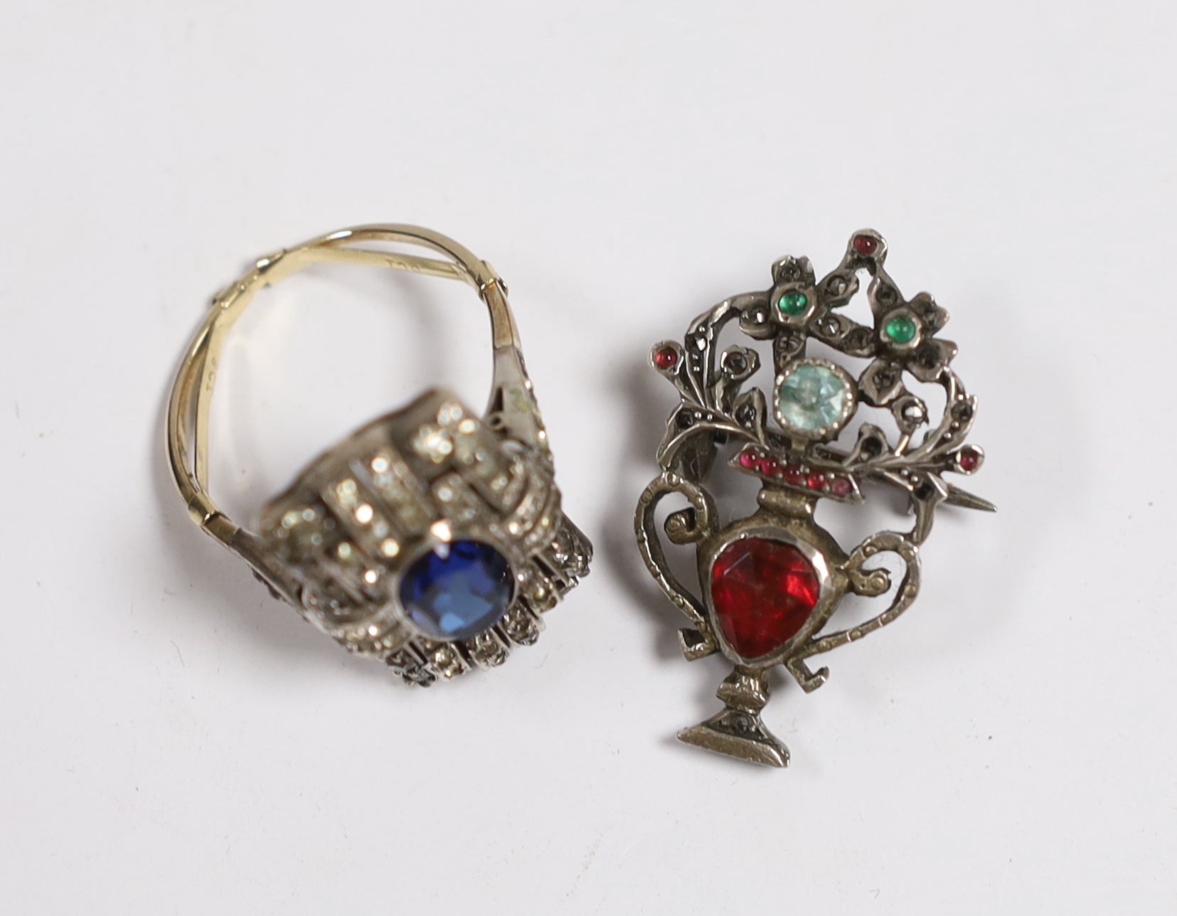 A 1920's? yellow and white metal, two colour paste cluster set dress ring and a similar white metal and paste set brooch, 31mm.